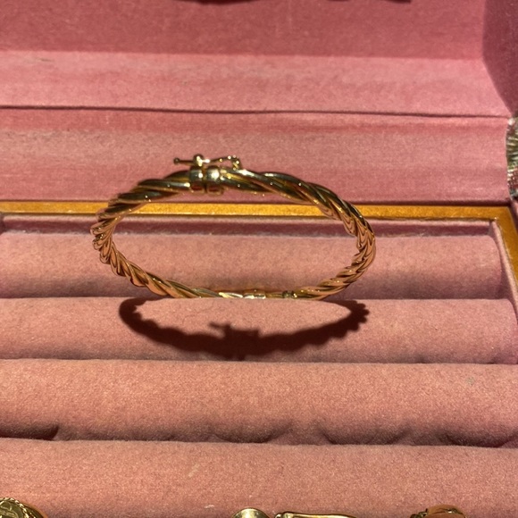14 karat gold twisted band bracelet.